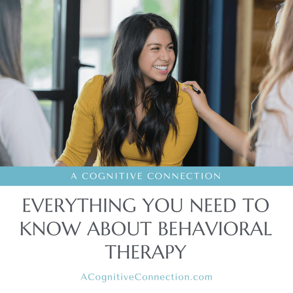woman smiling with white box in the bottom of the image that reads Everything You Need To Know About Behavioral Therapy"
